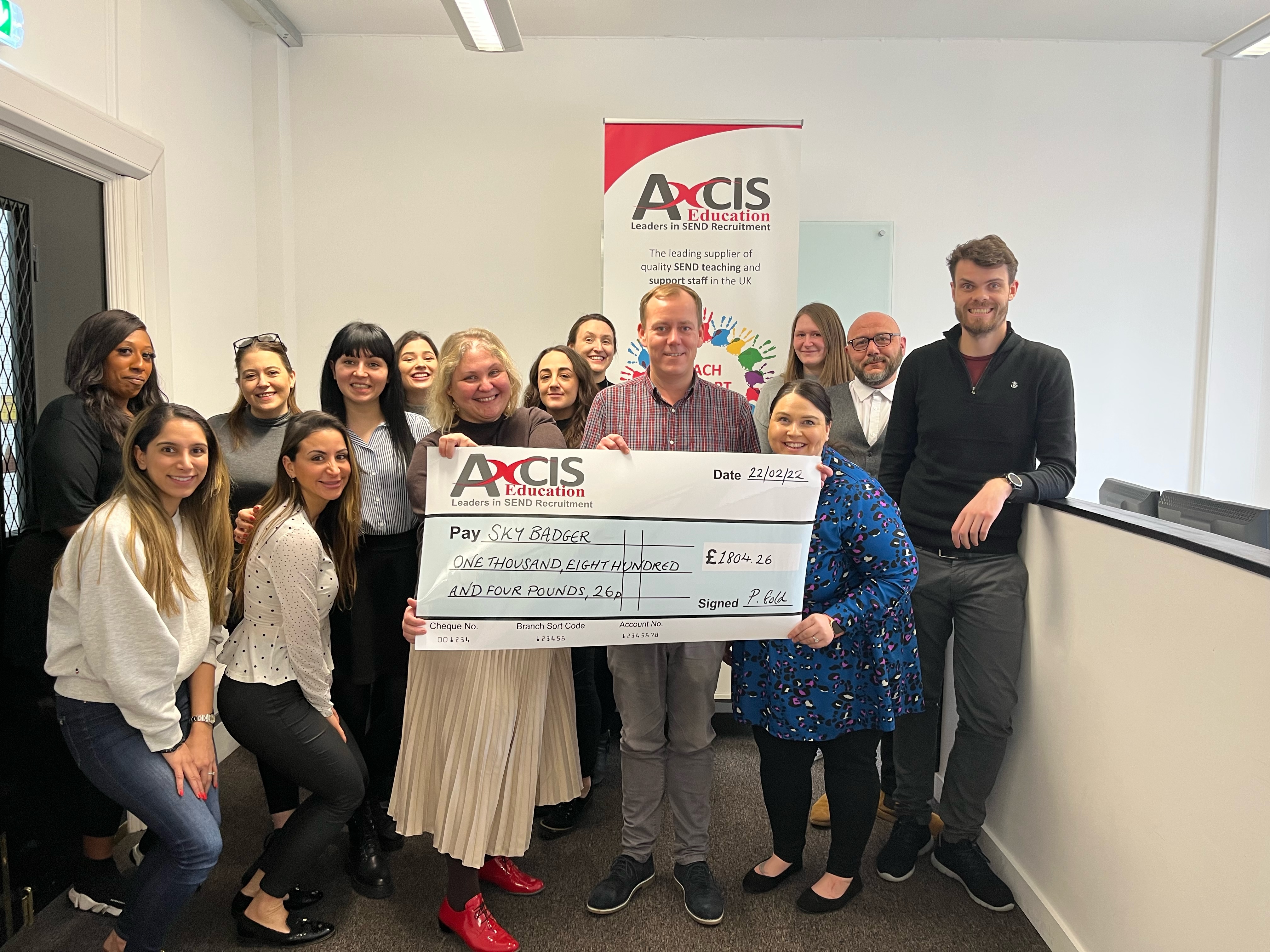 Axcis presents fundraising proceeds to 2021 annual charity of the year - Sky Badger